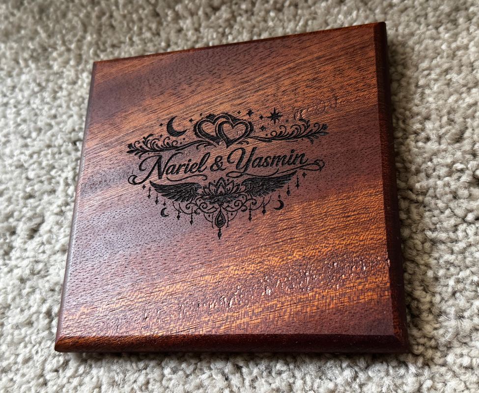 Square dark wood keepsake with a laser-engraved design